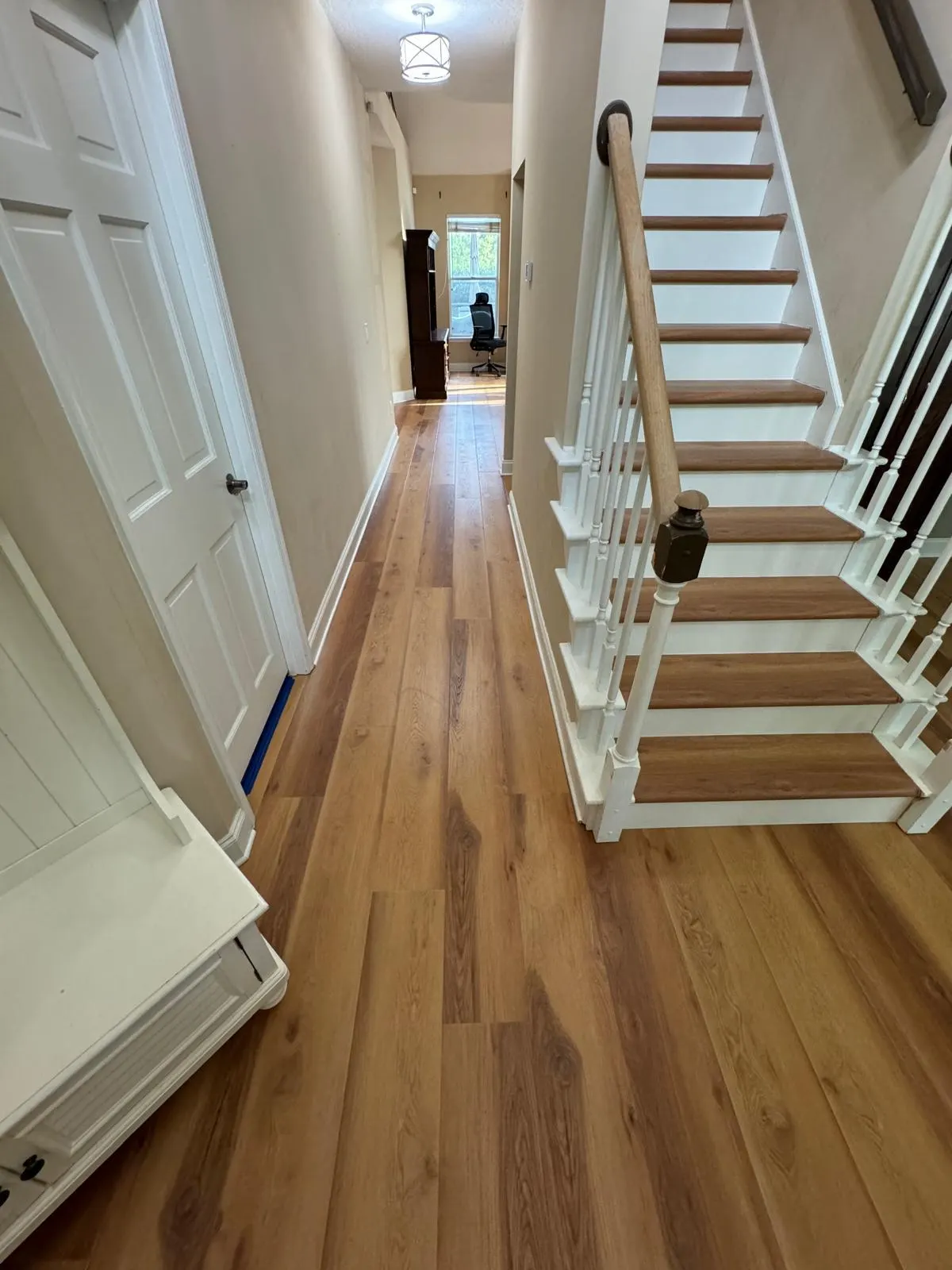 Oak hardwood plank hallway installation