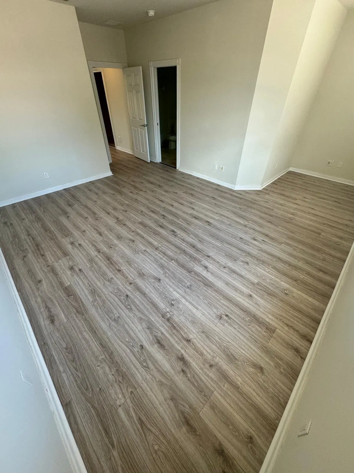 Waterproof luxury vinyl plank flooring in a bright room